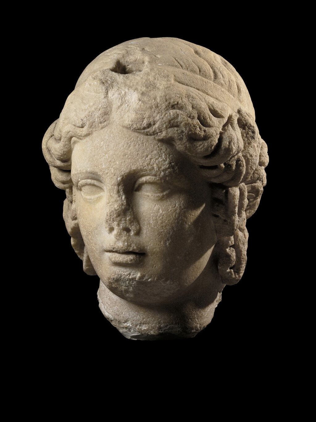 View full screen - View 1 of Lot 59. A Marble Head of the Goddess Isis, Roman Imperial, 2nd Century A.D., probably from Egypt.