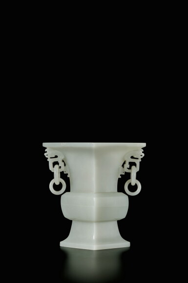 View full screen - View 1 of Lot 447. A white jade loose-handled gu-form vase, Qing dynasty, Qianlong period | 清乾隆 白玉雕雙耳活環花觚.