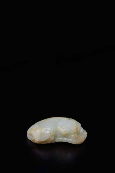 View full screen - View 1 of Lot 472. A celadon jade carving of a recumbent mythical beast, 17th century | 十七世紀 青白玉雕貔貅把件 .
