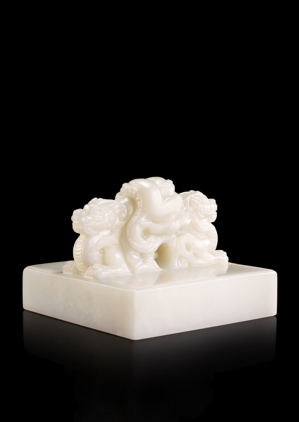 View full screen - View 1 of Lot 3643. An exceptional imperial white jade ‘Qianlong yubi’ seal, the seal: early Qing dynasty, the seal face: Qing dynasty, Qianlong period | 清初 (印鈕)/乾隆(印文) 乾隆帝御寶白玉交龍鈕璽 印文:乾隆御筆.