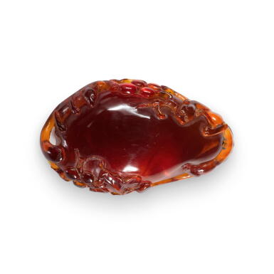 View full screen - View 1 of Lot 798. An amber 'squirrel and grape' pendant, Qing dynasty, 18th century | 清十八世紀 琥珀雕松鼠葡萄紋珮.