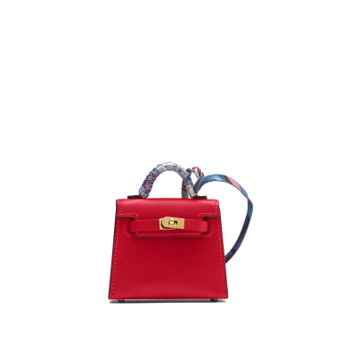 View full screen - View 1 of Lot 1057. Rouge Vif Tadelakt Micro Mini Twilly Kelly Bag Charm Gold Hardware, 2022.