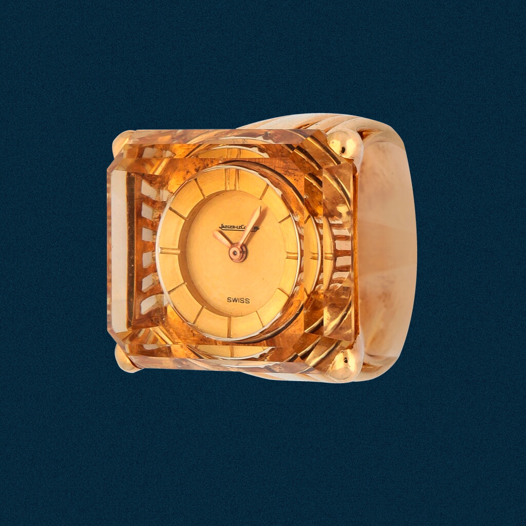 View full screen - View 1 of Lot 7. Reference 7295 | A yellow gold and citrine-set ring watch | Circa 1953.