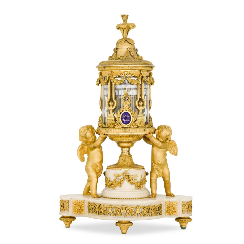 View full screen - View 1 of Lot 221. A Louis XVI-style gilt-bronze and white marble cercles tournants mantel clock, circa 1880.