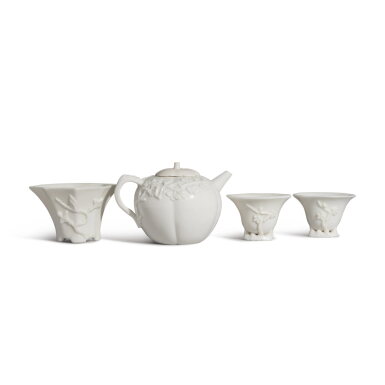 View full screen - View 1 of Lot 88. A group of three 'Dehua' cups and a 'Dehua' teapot and cover, Qing dynasty | 清 德化白瓷小杯一組三件及德化白瓷茶壺.