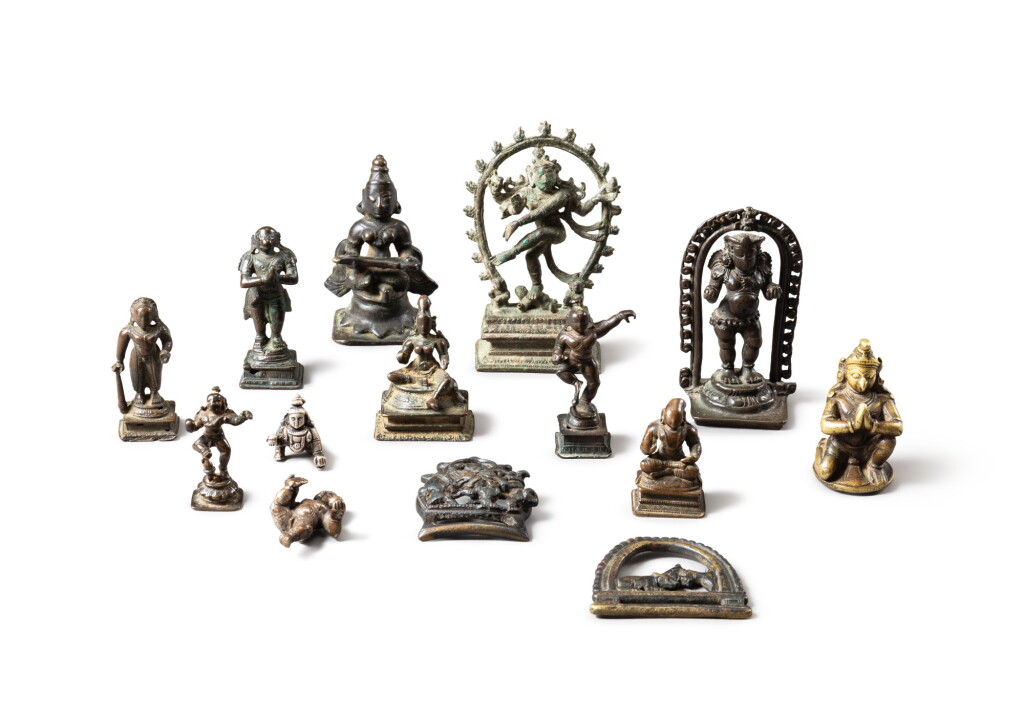 View full screen - View 1 of Lot 92. A group of fourteen small copper-alloy figures of deities India, 14th- 19th century | 印度 十四至十九世紀 合金銅佛像一組十四件.