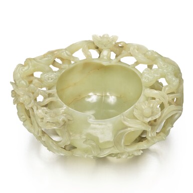 View full screen - View 1 of Lot 35. A celadon jade peach-form waterpot, Ming dynasty | 明 青玉鏤雕穿花螭龍紋桃形洗.