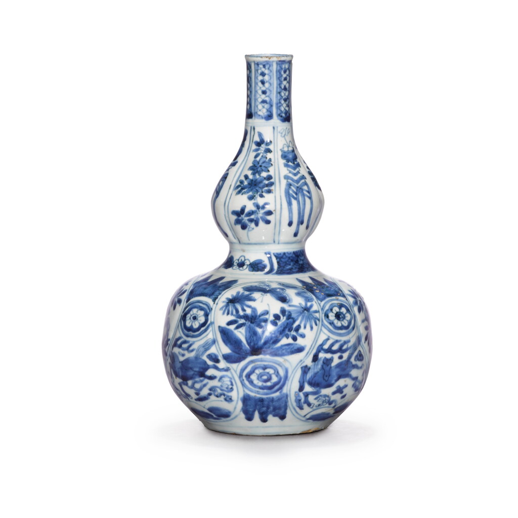 View full screen - View 1 of Lot 21. A moudled blue and white double-gourd vase, Ming dynasty, 17th century .