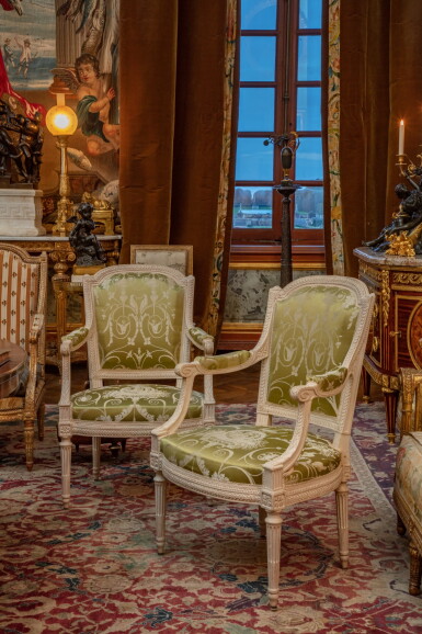 View full screen - View 1 of Lot 58. A pair of Louis XVI lacquered oak and walnut armchairs, by Georges Jacob, circa 1780 | Paire de fauteuils en cabriolet en noyer et chêne laqué blanc d’époque Louis XVI, par Georges Jacob, vers 1780.