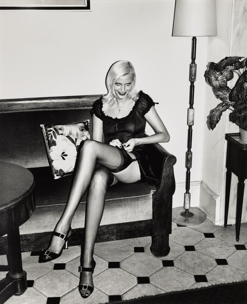 View full screen - View 1 of Lot 3. HELMUT NEWTON | 'NADJA ADJUSTING STOCKING', HOTEL BALMORAL, MONTE CARLO, 1994.