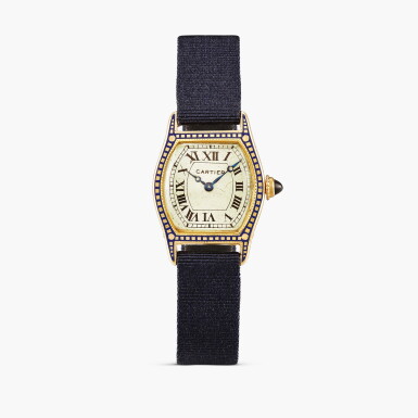 View full screen - View 1 of Lot 2475. London retailed | Tortue à Pattes | An unusual tonneau-form yellow gold wristwatch with decorative blue enamel inlay and gold deployant buckle, Circa 1926.