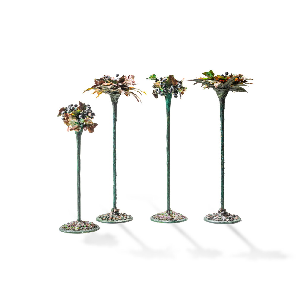 View full screen - View 1 of Lot 129. A set of four polychrome resin and fabric candlesticks, modern.