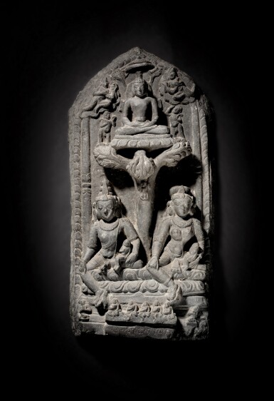 View full screen - View 1 of Lot 166. A black stone stele depicting Gomedha and Ambika with a Tirthankara, East India, Pala period, 11th / 12th century .