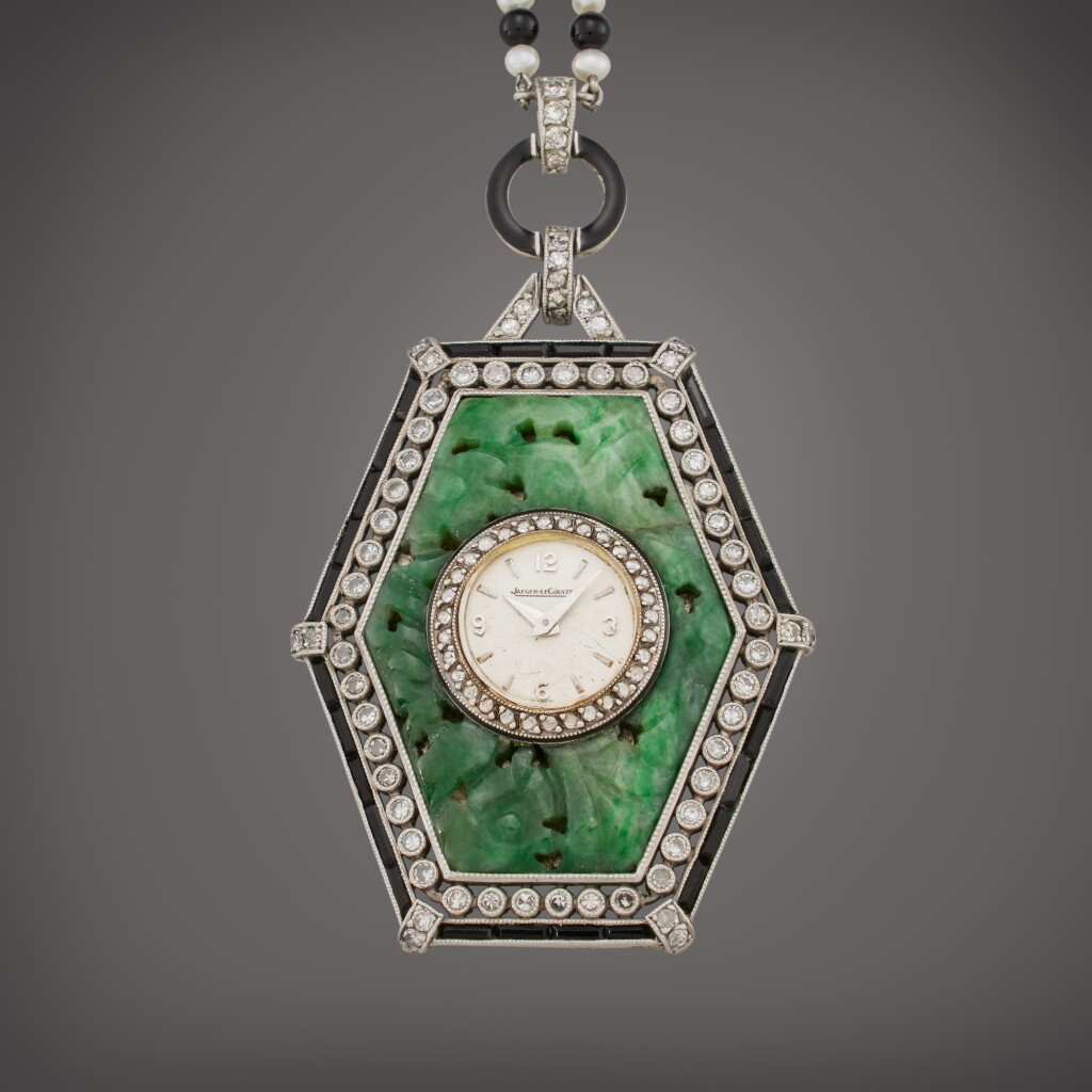 View full screen - View 1 of Lot 403. A hexagonal white gold, jadeite, diamond, and onyx pendant watch, Circa 1940.