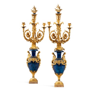 View full screen - View 1 of Lot 76. A pair of Louis XVI gilt and blue-patinated bronze candelabra, circa 1784-1786, attributed to Lucien-François Feuchère.