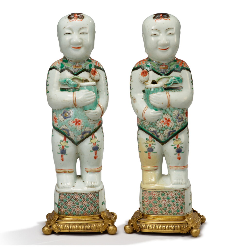 View full screen - View 1 of Lot 58. A PAIR OF ORMOLU-MOUNTED CHINESE EXPORT FAMILLE-VERTE FIGURES OF BOYS, THE PORCELAIN QING DYNASTY, KANGXI PERIOD, THE MOUNTS LATER.
