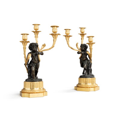 View full screen - View 1 of Lot 374. A pair of Louis XVI style patinated and gilt-bronze aux satyres enfants candelabra, after a model by Clodion, 19th century | Paire de candélabres aux satyres enfants en bronze patiné et doré de style Louis XVI, XIXe siècle.