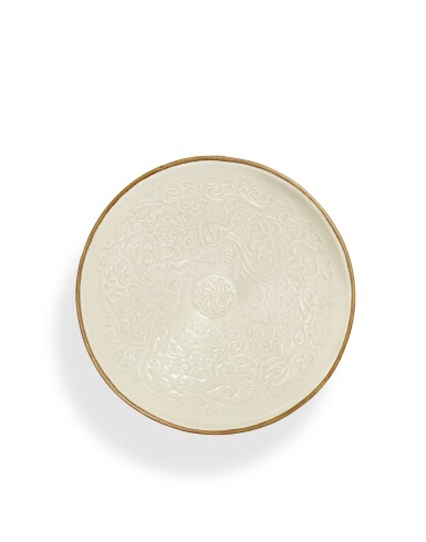 View full screen - View 1 of Lot 5002. A rare and finely moulded Dingyao 'pomegranate' bowl, Northern Song - Jin dynasty | 北宋至金 定窰白釉印海石榴紋盌.