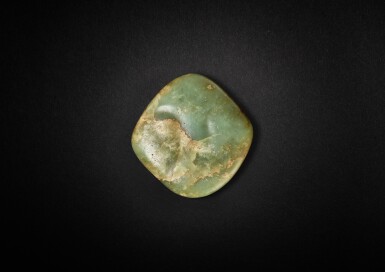 View full screen - View 1 of Lot 3780. A yellowish-celadon jade 'human face' ornament, Inner Mongolia, Neolithic period or later | 新石器時代或更晚 內蒙古青黃玉人面飾.