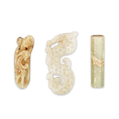 View full screen - View 1 of Lot 504. A partly calcified jade octagonal plug, Han dynasty, and two archaistic jade ‘dragon’ ornaments, Qing dynasty, 19th century 漢 玉塞 及 清十九世紀 玉龍紋珮兩件.
