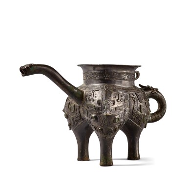 View full screen - View 1 of Lot 12. An exceptionally rare archaic bronze ritual pouring vessel (He), Eastern Zhou dynasty, Spring and Autumn period | 東周 春秋 青銅獸面紋龍流盉.
