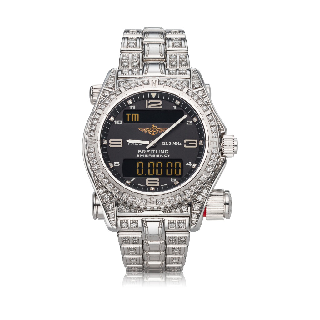 View full screen - View 1 of Lot 415. Reference E7632110 Emergency A white gold and diamond multi-functional LCD display bracelet wristwatch, Circa 2010.