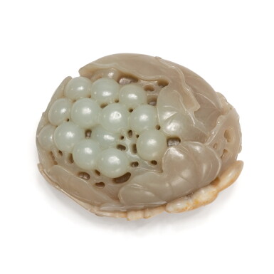 View full screen - View 1 of Lot 745. A pale celadon and russet jade 'squirrel and grapes' group, Qing dynasty, 19th century | 清十九世紀 青白玉糖色松鼠葡萄把件.
