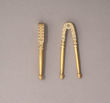 View full screen - View 1 of Lot 278. A pair of silver-gilt nutcrackers, probably English, dated 1716, maker’s mark FL in a heart.