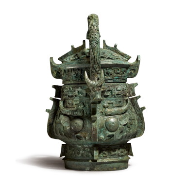 View full screen - View 1 of Lot 574. A RARE ARCHAIC BRONZE RITUAL WINE VESSEL AND COVER (YOU), LATE SHANG / EARLY WESTERN ZHOU DYNASTY.