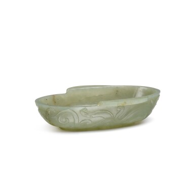 View full screen - View 1 of Lot 128. A small archaistic celadon jade 'chilong' ear cup, Qing Dynasty, 17th/18th century | 清十七/十八世紀 青玉仿古螭龍紋耳杯.