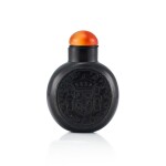 A Black Stone Carved 'Spanish Coin' Snuff Bottle Qing Dynasty, 18th - 19th Century | 清十八至十九世紀 黑石浮雕西班牙錢幣圖鼻煙壺