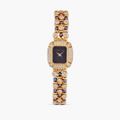 View full screen - View 1 of Lot 453. A special order yellow gold, pearl and diamond-set bracelet watch with onyx dial, Circa 1984.