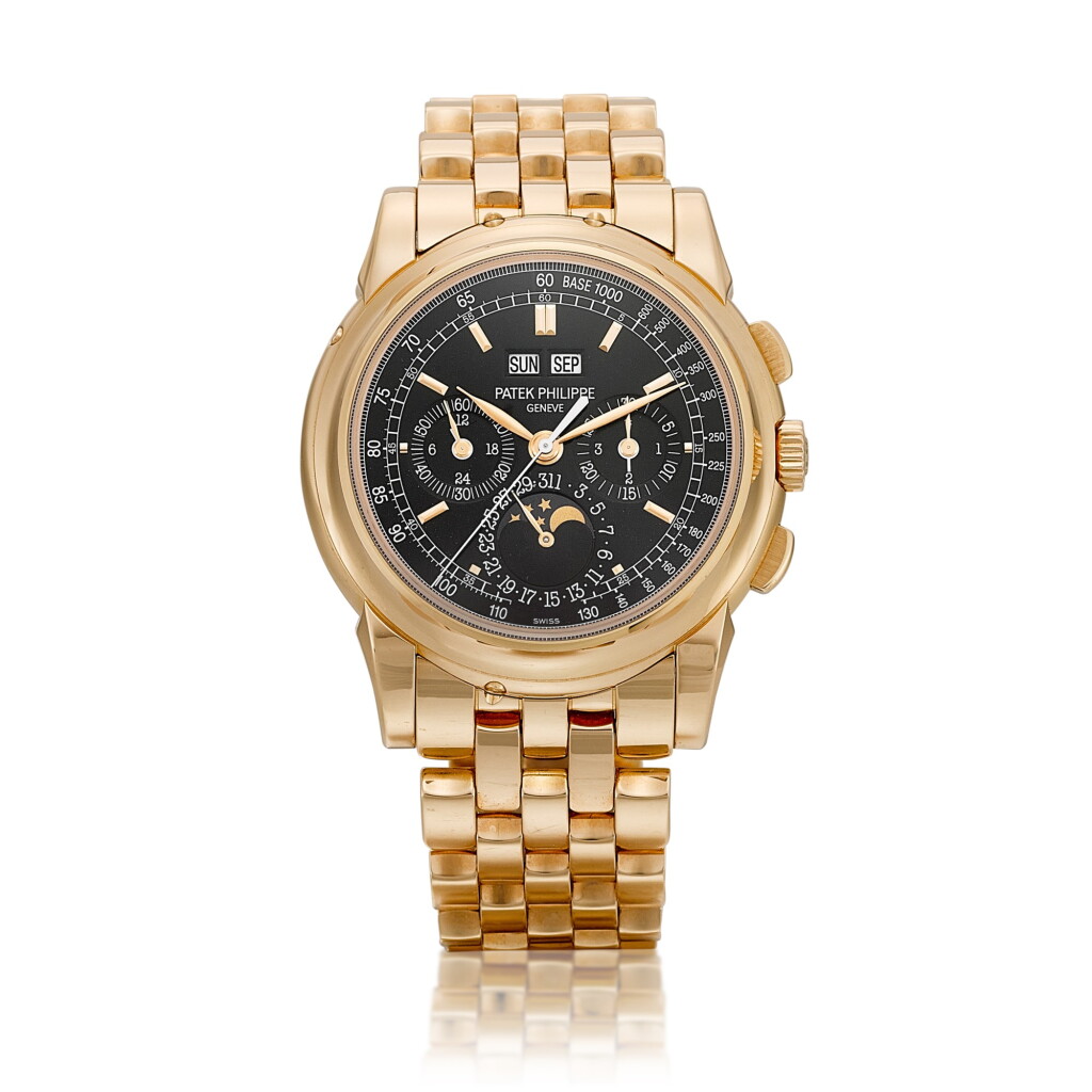 View full screen - View 1 of Lot 2304. Reference 5970 | A highly important and extremely rare pink gold perpetual calendar chronograph wristwatch with day, date, moon phases, 24 hours, leap year indication, tachometer scale, black dial and bracelet, Circa 2014 | 百達翡麗 | 型號5970 | 非常重要及稀有粉紅金萬年曆計時鏈帶腕錶,備日期、星期、月相、24小時及閏年顯示、測速刻度及黑色錶盤,約2014年製.