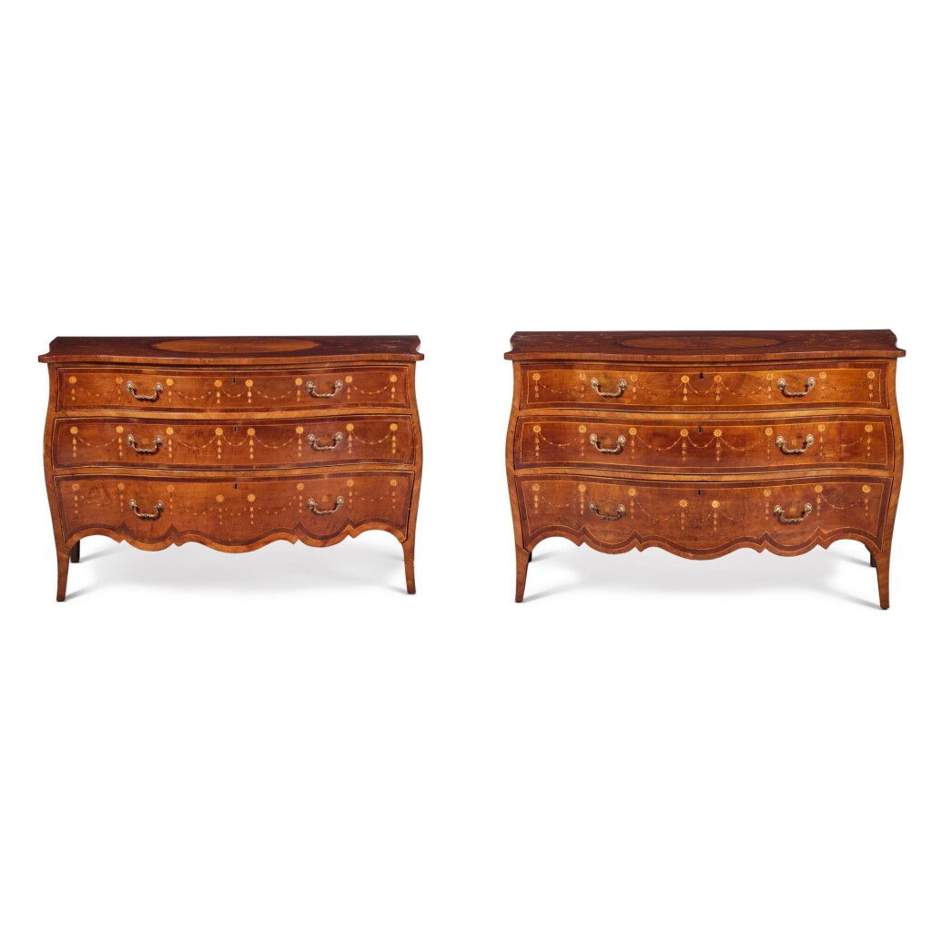 View full screen - View 1 of Lot 35. A Near Pair of George III Harewood, Satinwood and Tulipwood Inlaid Serpentine Commodes, circa 1775 in the manner of Langlois.