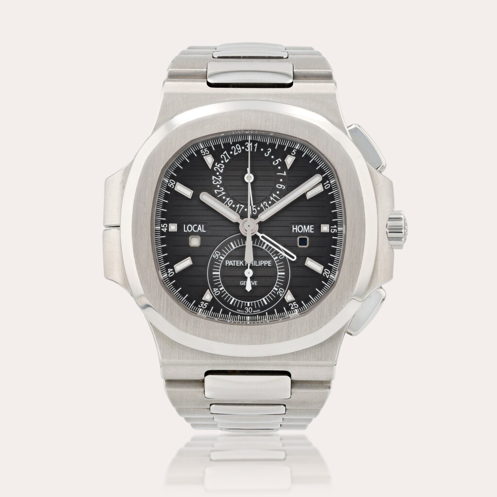 View full screen - View 1 of Lot 379. Nautilus, travel time chronograph, reference 5990/1A-001 Montre bracelet chronographe en acier avec date, double fuseau horaire et indication jour/nuit | Stainless steel chronograph wristwatch with date, dual time zone, day/night indication and bracelet Vers 2019 | Circa 2019.