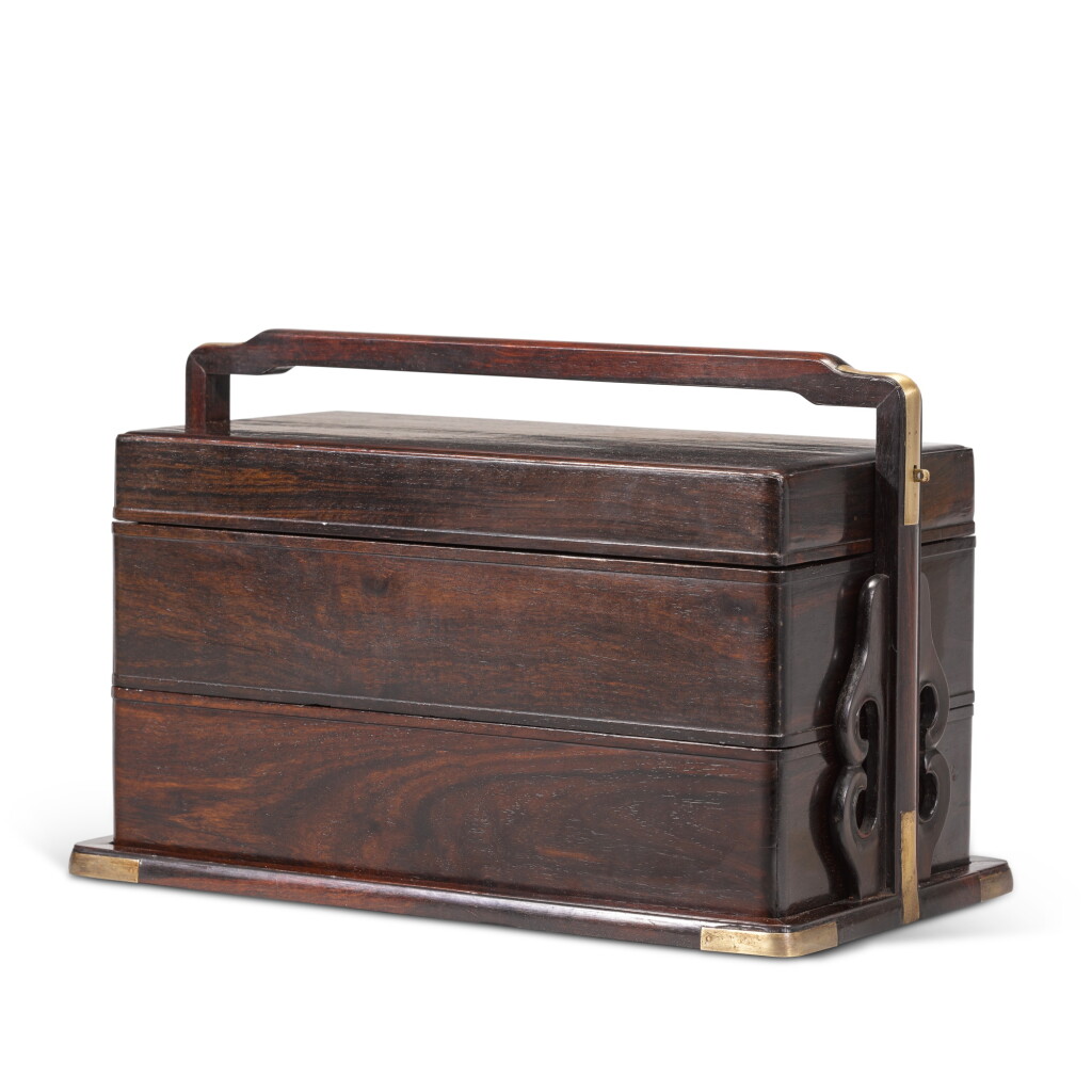 Voir en plein écran - Voir 1 du lot 272. A 'zitan' two-tiered picnic box and cover, Qing dynasty, 18th century | 清十八世紀 紫檀兩撞提盒.
