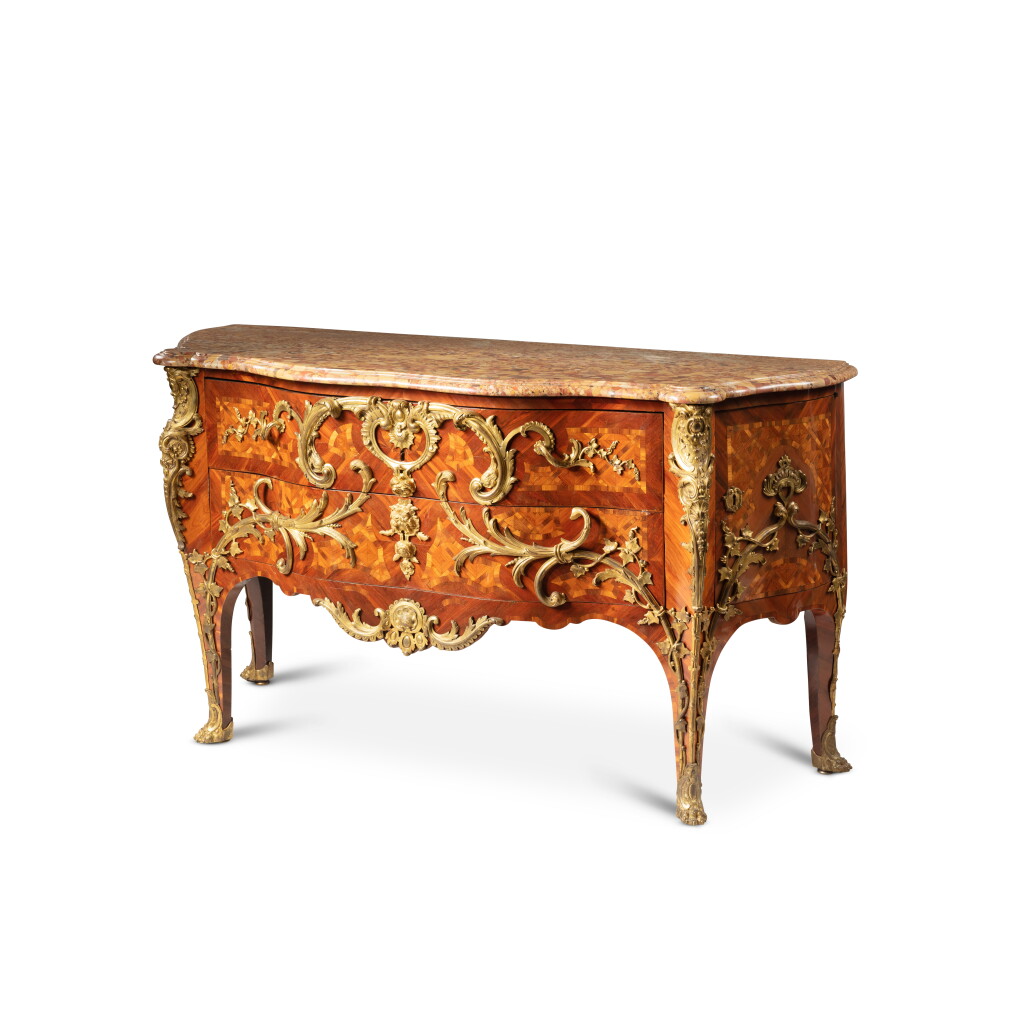 View full screen - View 1 of Lot 10. A Louis XV gilt-bronze mounted bloodwood and tulipwood veneered commode "à palmes croisées et branches de lierre", circa 1740-1750, by Charles Cressent | Commode à palmes croisées et branches de lierre en placage de satiné, bois de rose et bronze doré d'époque Louis XV, vers 1740-1750, par Charles Cressent.