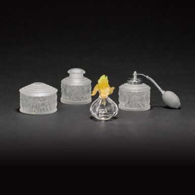 View full screen - View 1 of Lot 47. A Daum glass scent bottle and stopper and a three-piece Lalique ‘Enfant’ dressing table set, modern.