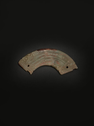 View full screen - View 1 of Lot 209. An archaic celadon jade 'mythical beast' pendant (Huang), Western Zhou dynasty | 西周 青玉人首龍身紋璜.