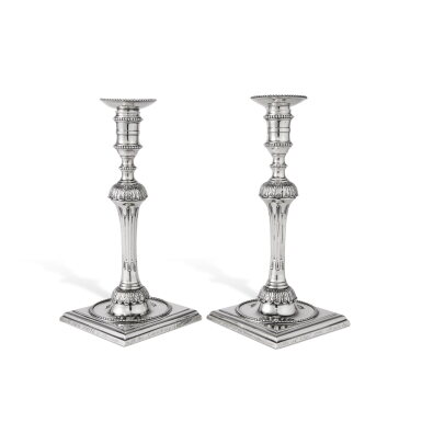 View full screen - View 1 of Lot 33. A Pair of George III Silver Candlesticks with Royal Naval Presentation Inscriptions, Henry Hallsworth, London, 1776.