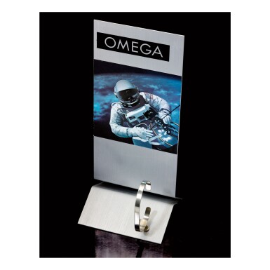 View full screen - View 1 of Lot 46. OMEGA | A STAINLESS STEEL OMEGA ADJUSTABLE WATCH STAND DEPICTING AN ASTRONAUT, CIRCA 1995.