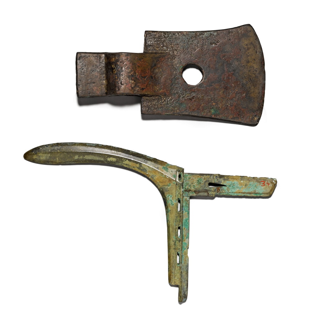 View full screen - View 1 of Lot 4. A bronze socketed axe head and a bronze halberd blade (ge) The socketed axe Shang dynasty, the halberd blade Eastern Zhou dynasty, Warring States period | 商 青銅斧 及 東周 戰國時期 青銅戈.