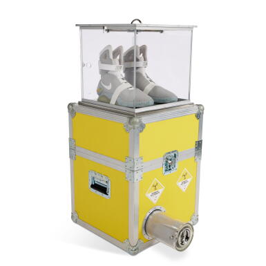 View full screen - View 1 of Lot 8. 2011 Nike MAG ‘Back to The Future’ | Size 13 | Limited Edition Plutonium Case | Advertisement Production Book .