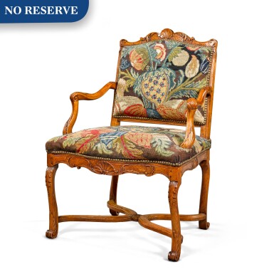 View full screen - View 1 of Lot 52. A Régence provincial carved beechwood fauteuil, circa 1730.