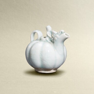 View full screen - View 1 of Lot 5748. A small qingbai-glazed 'buffalo and boy' melon-shaped dropper, Song dynasty | 宋 青白童子牧牛瓜棱形水注.