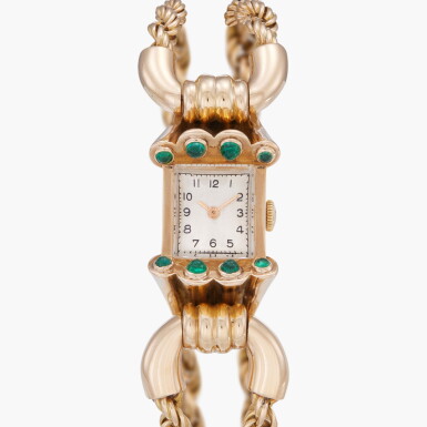 View full screen - View 1 of Lot 249. Retailed by Guillermain: A pink gold and emerald-set bracelet watch | Circa 1950.