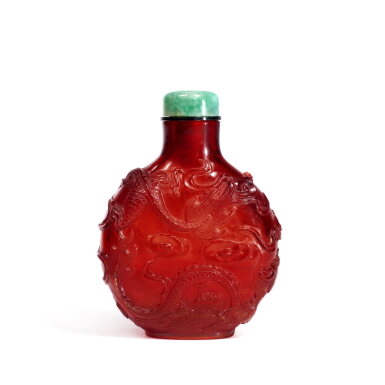 View full screen - View 1 of Lot 782. A ruby-red glass 'dragon' snuff bottle, Qing dynasty, 18th / 19th century | 清十八 / 十九世紀 寶石紅料海水趕珠雲龍紋鼻煙壺.