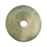 A celadon jade 'mythical bird' disc (Bi), Warring States period / Han dynasty | 戰國 / 漢 玉瑞鳥蒲紋璧
