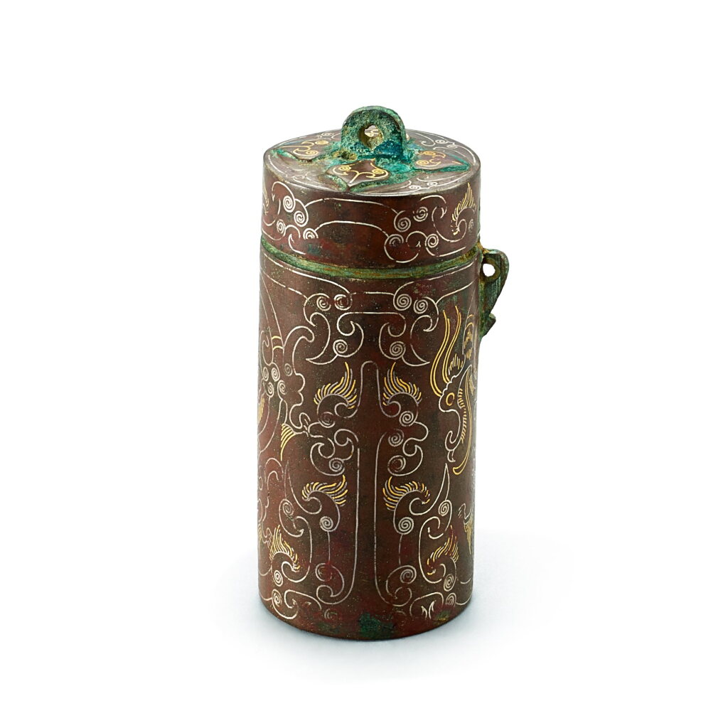 View full screen - View 1 of Lot 3041. A gold and silver-inlaid bronze 'dragon' cylindrical box, Warring States period | 戰國 銅錯金銀龍紋筒形盒.