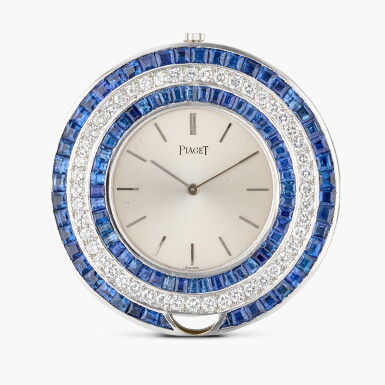 View full screen - View 1 of Lot 351. A white gold, diamond, and sapphire-set open-faced keyless pendant watch, Circa 1980.